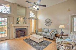Rowlett house for rent - A living room with a fireplace and a couch.