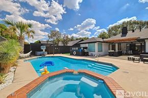 Plano house for rent - A pool with a blue inflatable duck in the middle of it.