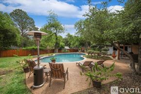 Lewisville house for rent - A backyard with a pool and patio furniture.