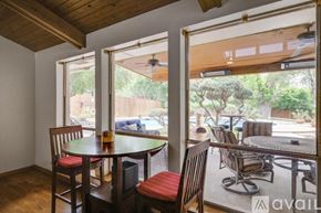 Lewisville house for rent - A dining area with a table and chairs is shown.