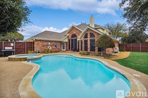 Rowlett house for rent - A house with a pool in the backyard.