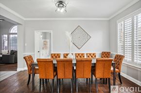 Rowlett house for rent - A dining room with a table set for six.