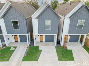 Houston house for rent - A house with grey siding and a brown roof is for sale.