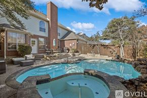 Plano house for rent - A backyard with a pool and a house.