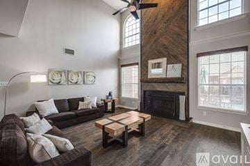 Plano house for rent - A living room with a brown couch and a wooden coffee table.