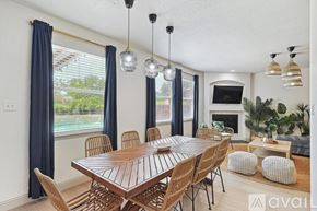 Saginaw house for rent - A dining room with a wooden table and chairs.