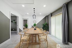 Lancaster house for rent - A modern dining room with a wooden table and chairs.