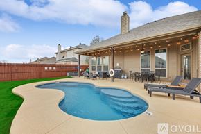 Waxahachie house for rent - A house with a pool in the backyard.