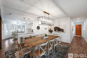 Keller house for rent - A modern dining room with a wooden table and chairs.