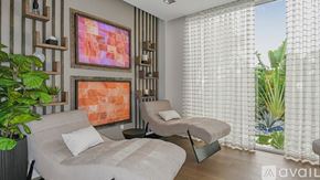 Bradenton townhouse for rent - A bedroom with a bed and a couch with a painting on the wall.