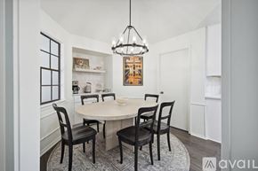 Allen house for rent - A dining room with a round table and chairs.