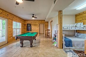 Clayton house for rent - A room with a pool table and bunk beds.