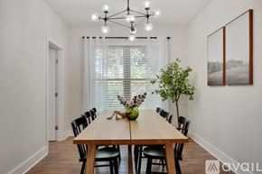 Flower Mound house for rent - A dining room with a wooden table and chairs.