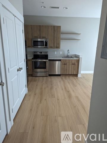 Idaho Springs apartment for rent - A kitchen with wooden cabinets and a white door.