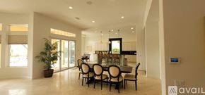 La Quinta house for rent - A dining room with a large table and chairs.