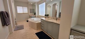 La Quinta house for rent - A bedroom with a large bed and a television.