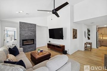 Dallas house for rent - A living room with a grey couch and a brown coffee table.