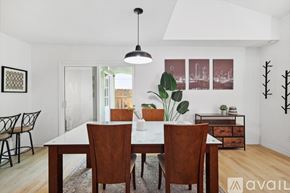 Dallas house for rent - A dining room with a white table and brown chairs.