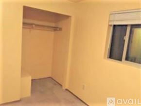 Lynnwood apartment for rent - A room with a window and a doorway leading to another room.