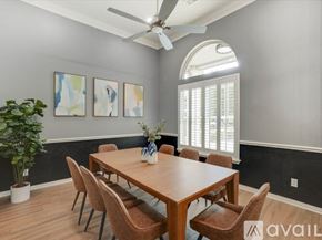 Lewisville house for rent - A dining room with a wooden table and chairs.