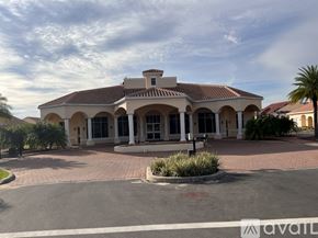 Tavares house for rent - A large building with a red tiled roof and a driveway in front.