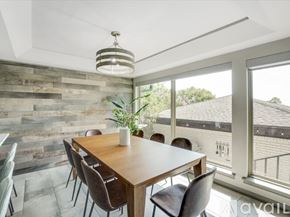 Rockwall house for rent - A dining room with a wooden table and chairs.