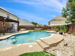 Haltom City house for rent - A backyard with a pool and patio furniture.