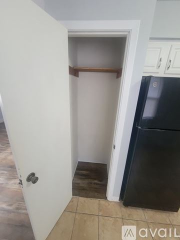 La Crosse apartment for rent - A kitchen with white appliances and wooden floors.