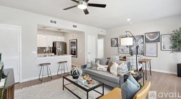 New Braunfels apartment for rent - A living room with a grey couch and a coffee table in the middle.
