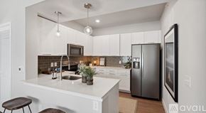 New Braunfels apartment for rent - A modern kitchen with a white countertop and stainless steel appliances.
