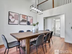 Allen house for rent - A dining room with a wooden table and chairs.