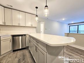 Chicago apartment for rent - A white bathroom with a sink and a mirror.