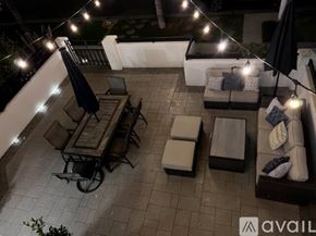 Huntington Beach house for rent - A patio with furniture and string lights.