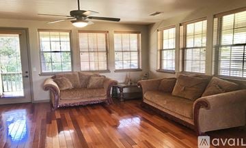 Prescott house for rent - A living room with two couches and a fan.