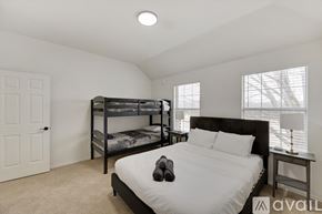 Plano house for rent - A bedroom with a bunk bed and a single bed.