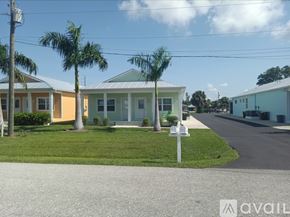 Punta Gorda apartment for rent - A row of houses with a sign in front of them.