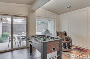 Plano house for rent - A kitchen with a stove top oven and a dining table outside.