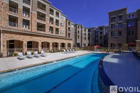 Mckinney apartment for rent - A large swimming pool in front of apartment buildings.