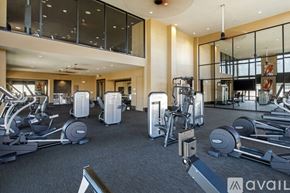 Fort Worth apartment for rent - A gym with a variety of equipment including treadmills, weights, and exercise machines.