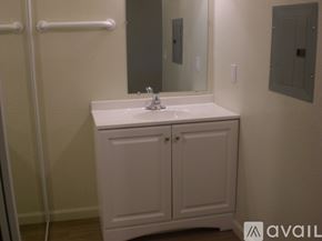 Santa Rosa apartment for rent - A bathroom with a sink, mirror, and cabinets.