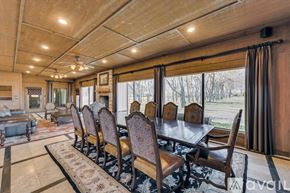 Celina house for rent - A dining room with a long table and chairs.