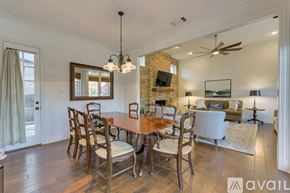 Mesquite house for rent - A dining room with a wooden table and chairs.