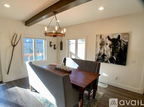 Ketchum house for rent - A modern dining room with a wooden table and chairs.