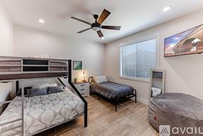 Lake Havasu City house for rent - A bedroom with a bunk bed and a single bed.