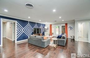 Houston house for rent - A dining room with a wooden table and chairs.