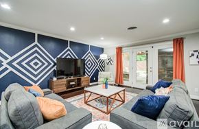 Houston house for rent - A kitchen with a table and chairs in the middle of the room.