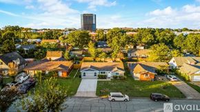Arlington house for rent - A suburban neighborhood with houses and a tall building in the background.