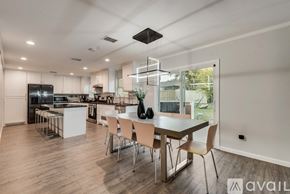 Arlington house for rent - A modern kitchen with a dining table and chairs.