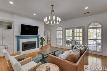 Richardson house for rent - A living room with a fireplace and a television on the wall.