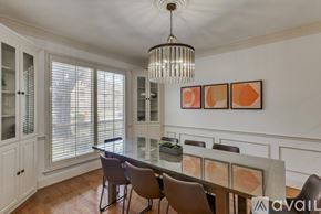 Richardson house for rent - A dining room with a table set for four.